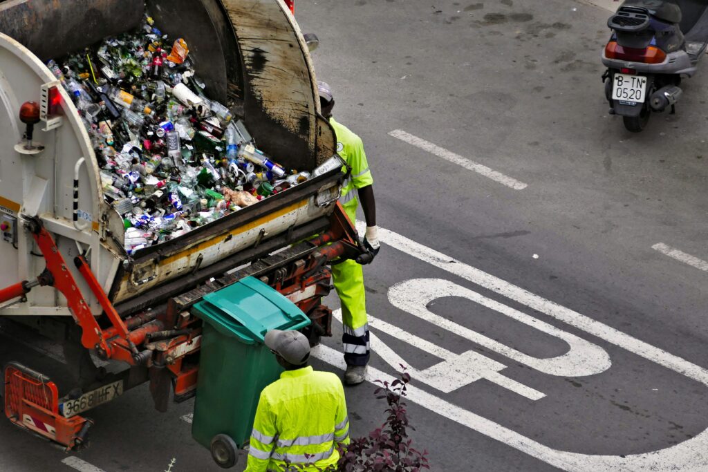 bin men collecting waste representing carbon capture trial